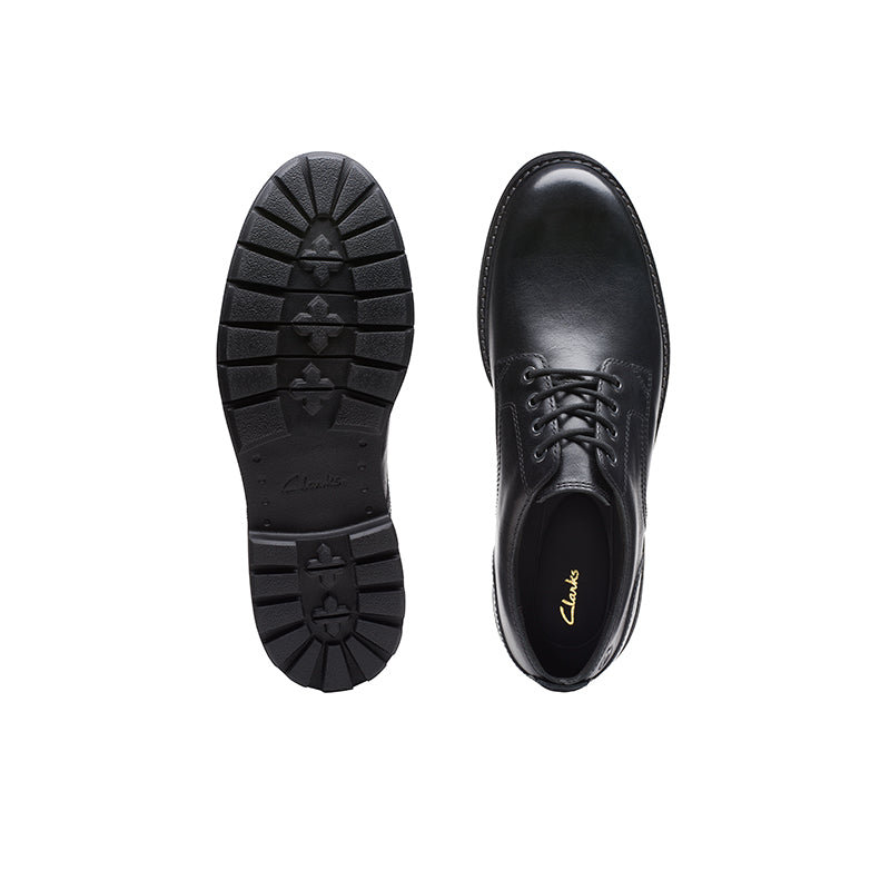 Men's black leather shoe sole and lace-up upper side view
