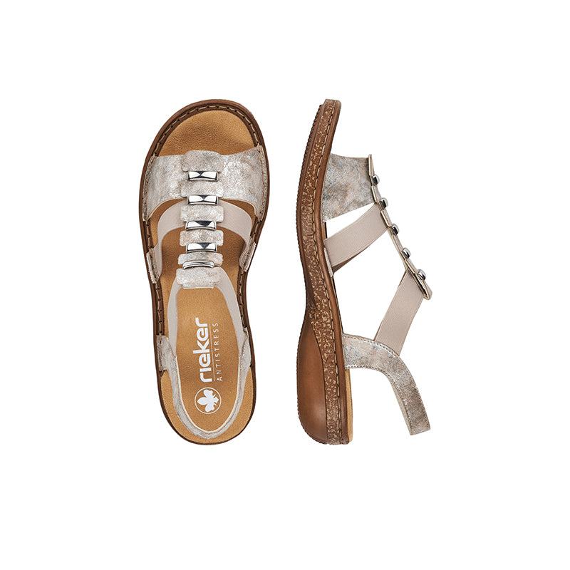 Silver top women's sandals with metal buckles and cushioned tan footbed