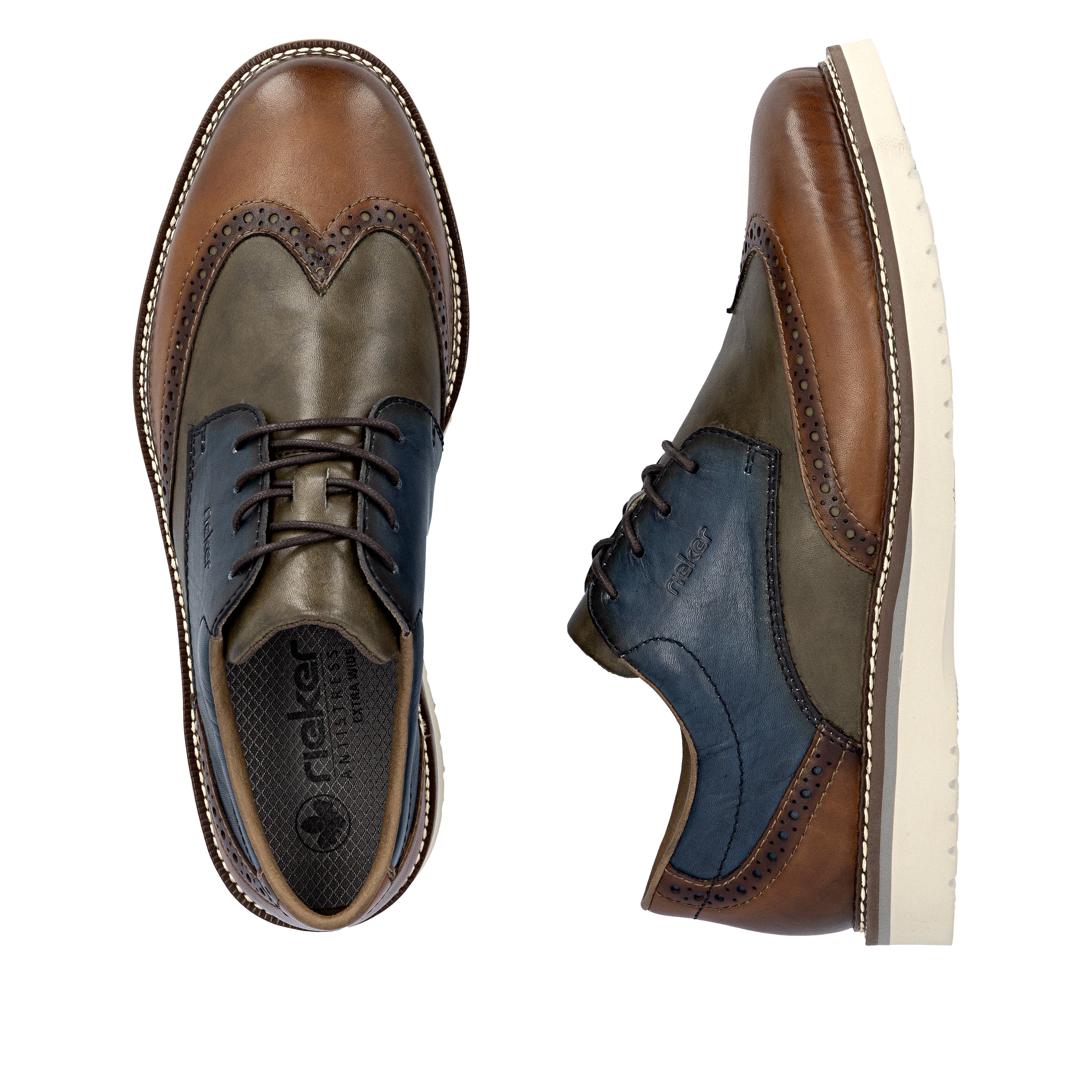 Men's brogue leather lace-up shoes close-up, blue and brown with cream sole.
