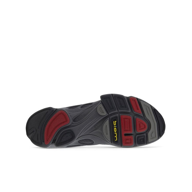 Men’s black sneaker outsole, textured tread with red and gray flex details