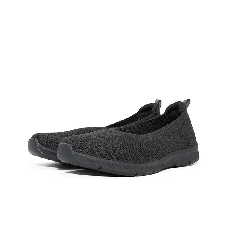 Women's black mesh slip-on sneaker angled heel view