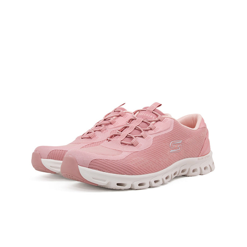 Pink textile women’s sneaker with lace-up vamp and molded tread sole