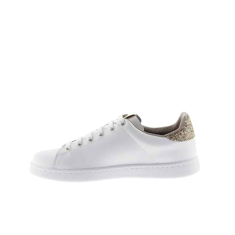 White low-top sneakers, side view with glitter gold heel detail and lace-up