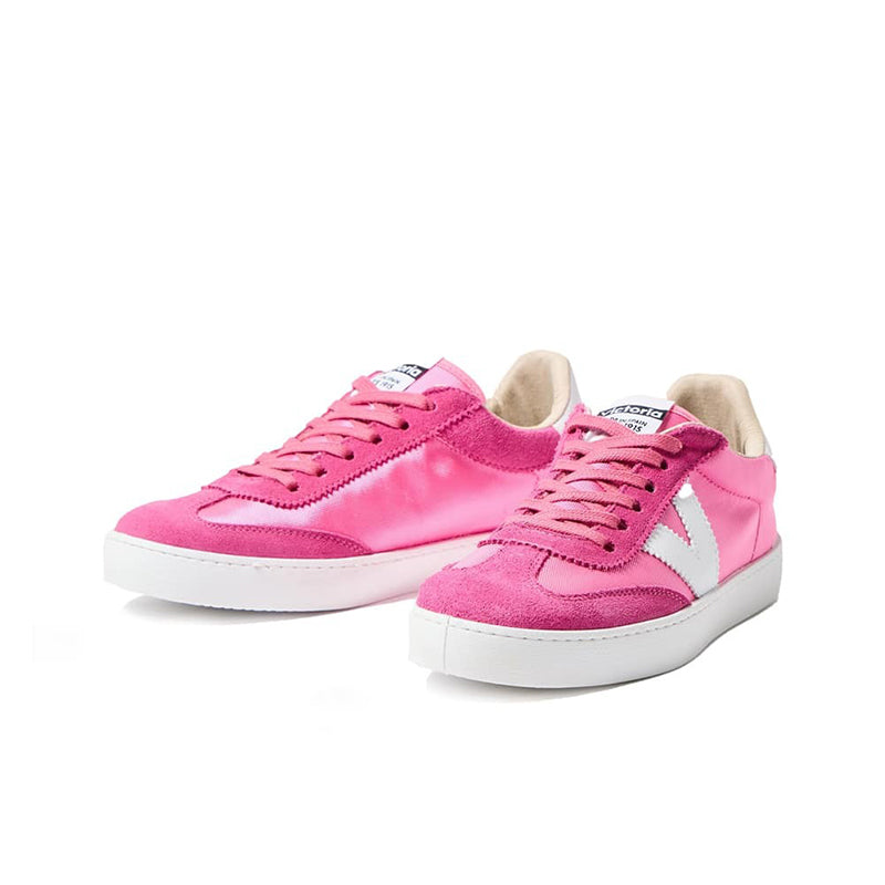 Fuchsia low-top lace-up sneakers with white side stripe and white rubber sole