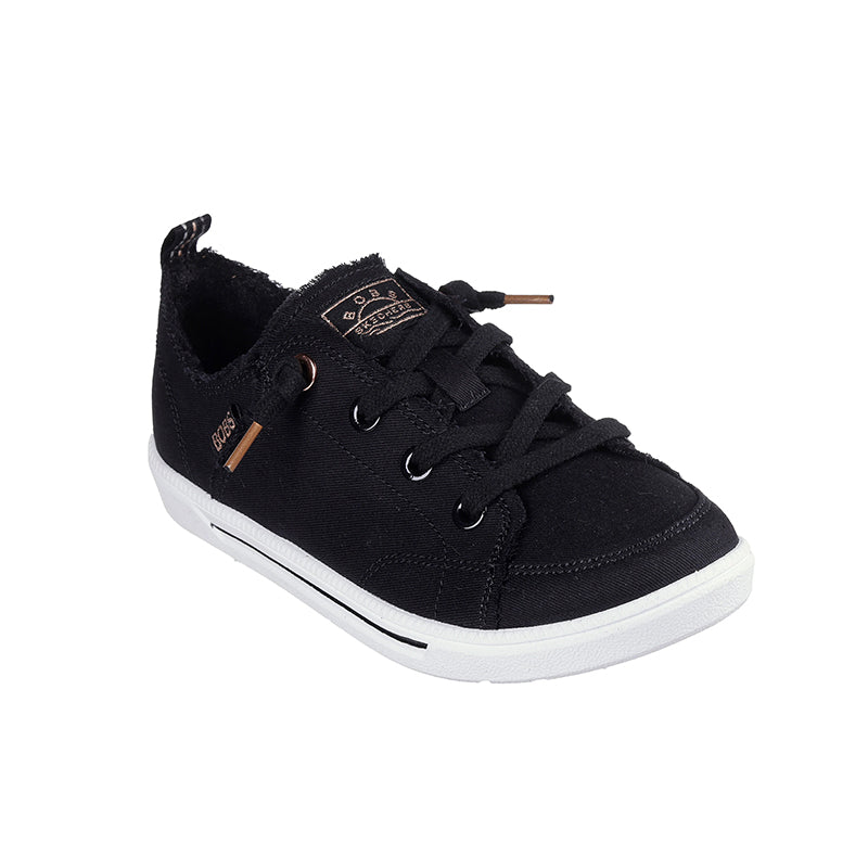 Black canvas low-top sneakers with lace-up front and tan accent hardware