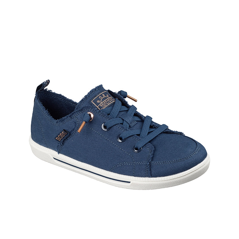 Blue canvas low-top sneakers with lace-up front and tan accent eyelets