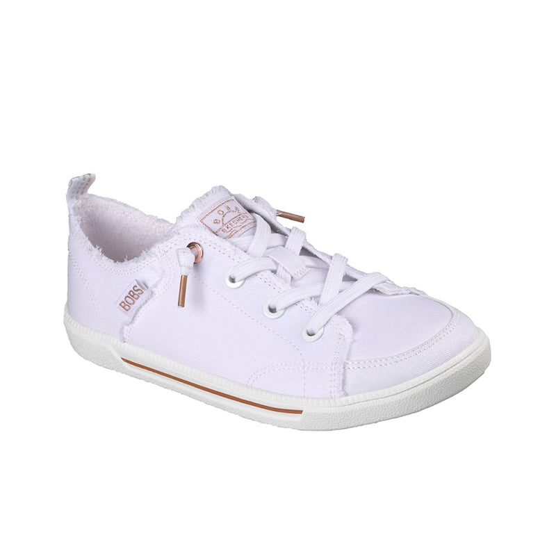 White canvas low-top sneakers with lace-up front and tan accent eyelets
