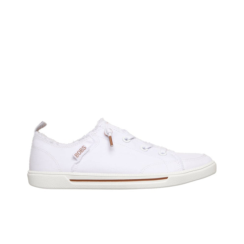 White canvas low-top sneakers with lace-up front, tan accent and stitching details