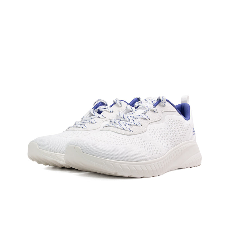 Off-white knit women's sneaker with blue accents and thick white rubber sole