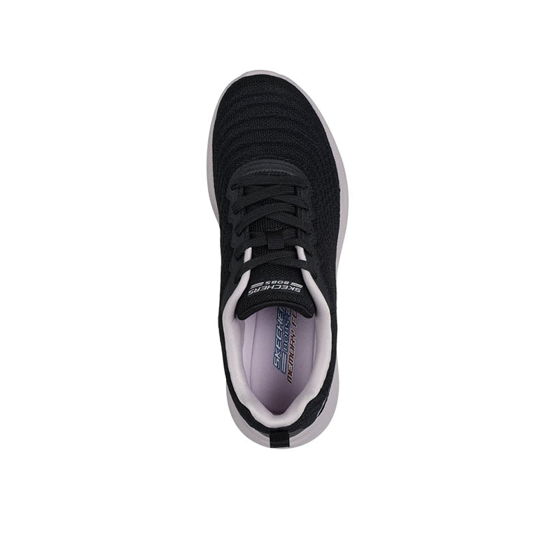 Women's black lace-up sneakers with padded tongue and white sole