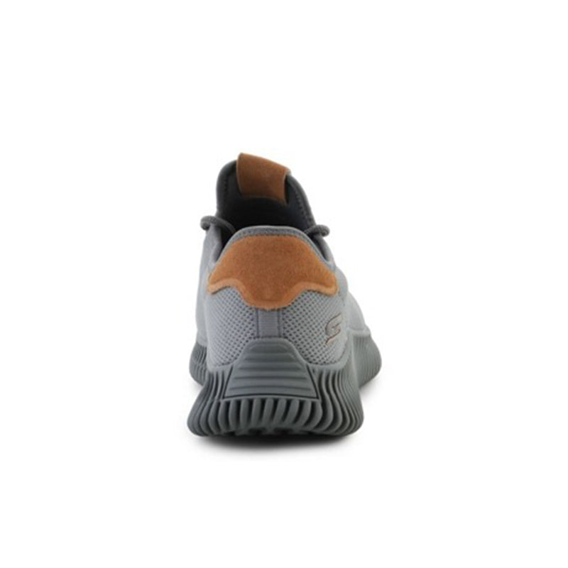 Grey men's sneaker heel view with tan suede patch and pull tab