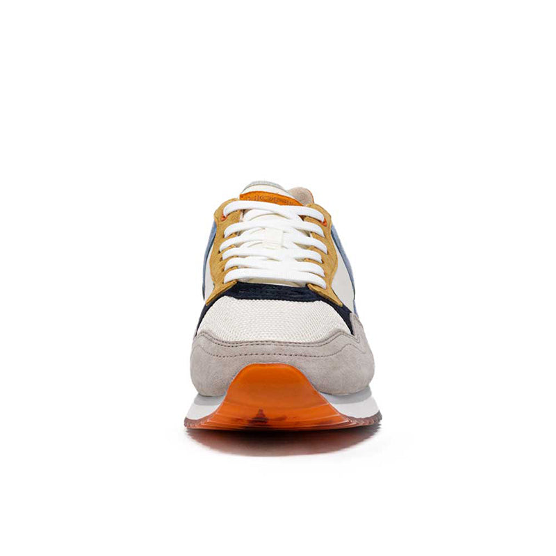 Men's leather sneakers back view with white upper, navy accents, and orange outsole