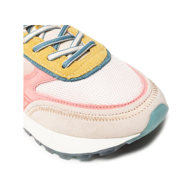 Low-top sneaker front in beige and pink with blue and yellow strap detail, lace-up