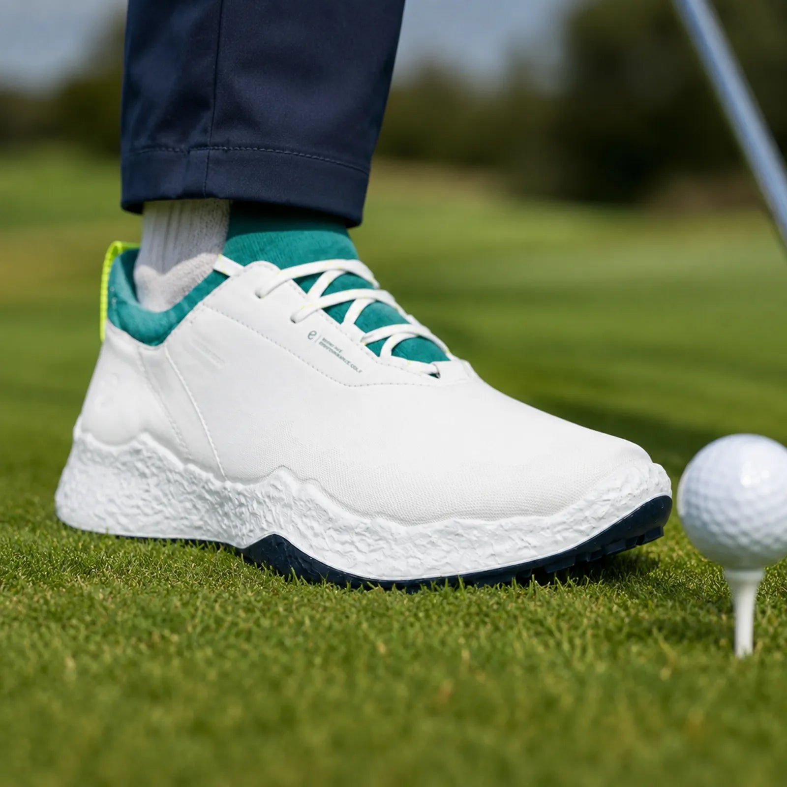ECCO BIOM H5 men's white and bay green golf shoes worn on the course