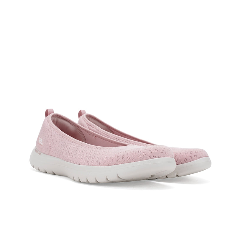 Women's blush pink textile slip-on sneakers, angled showing heel and toe