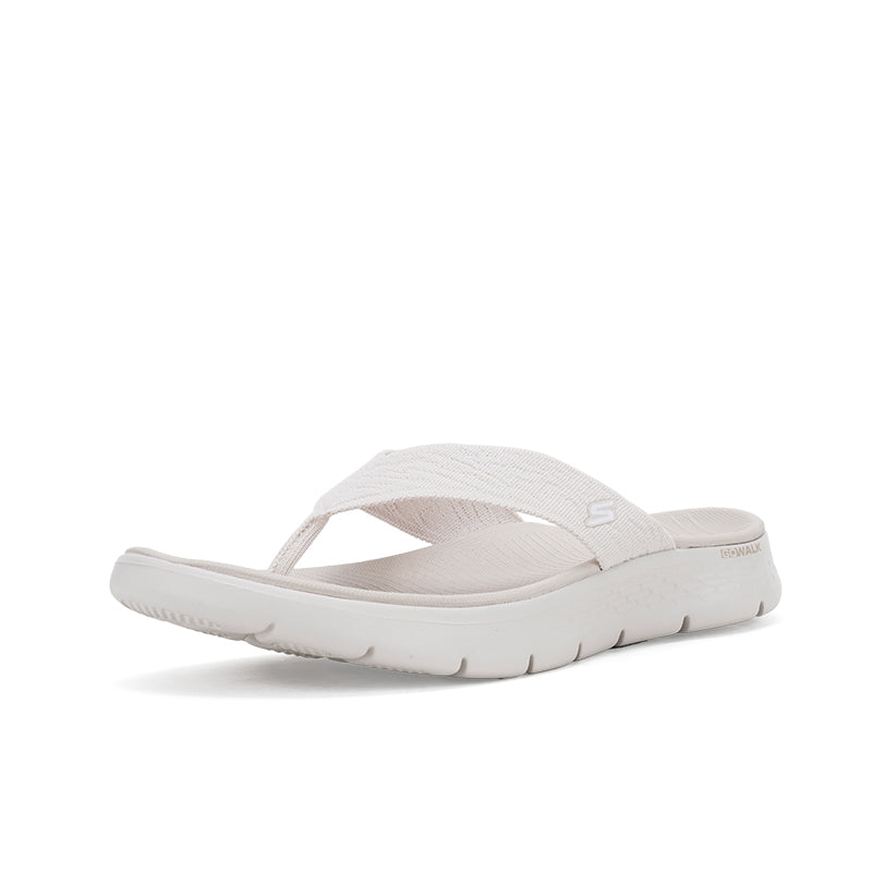 Women's slide sandal side view with stretchy strap and padded footbed, light neutral
