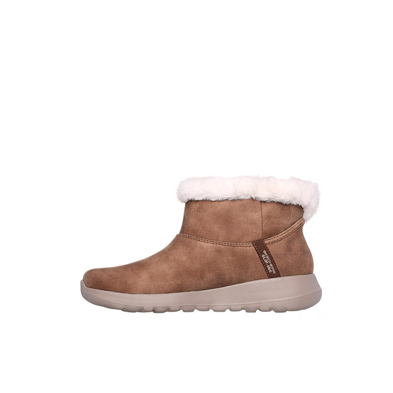 Tan slip-on boot with white faux-fur trim and side pull-tab detail