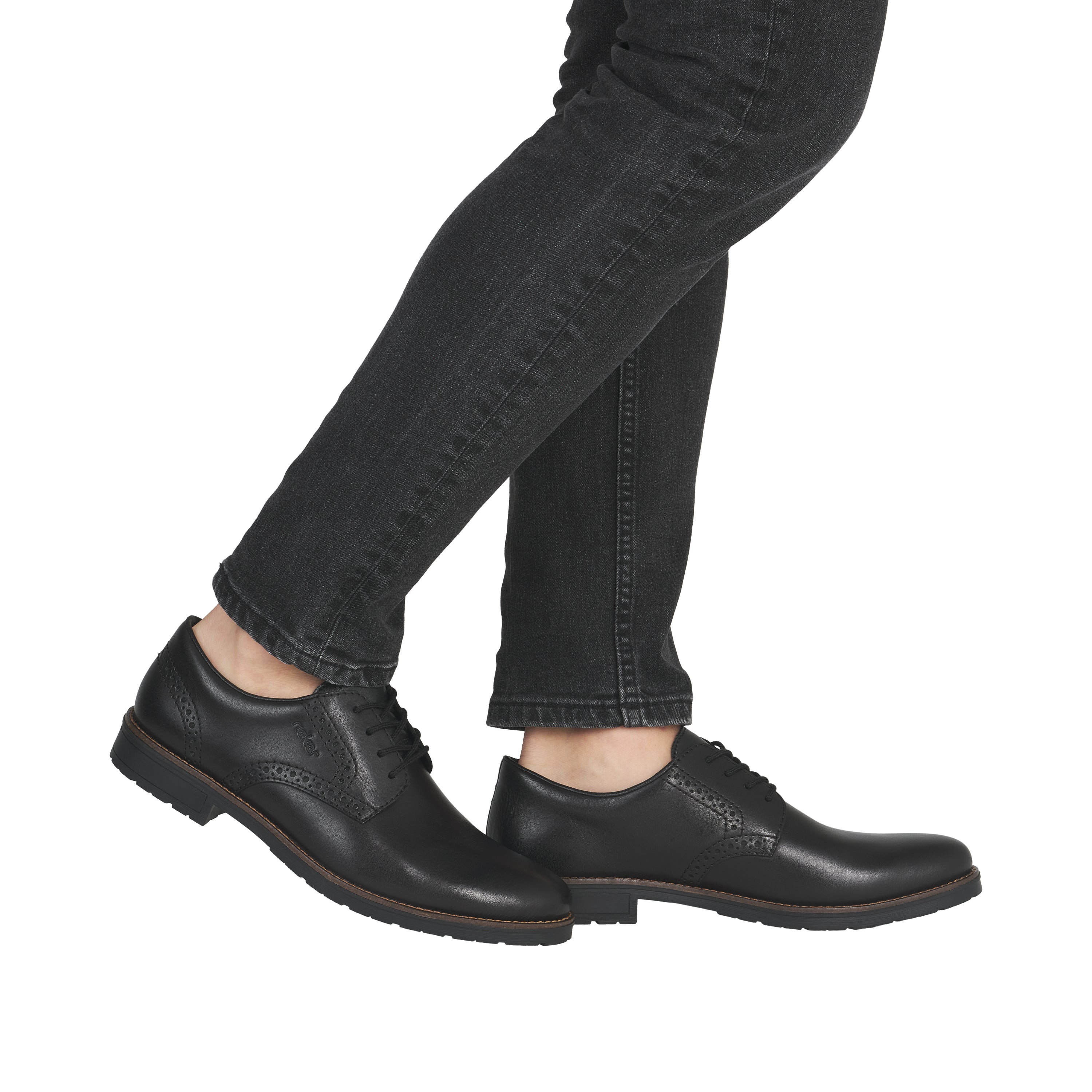 Black leather lace-up shoes with dark denim jeans