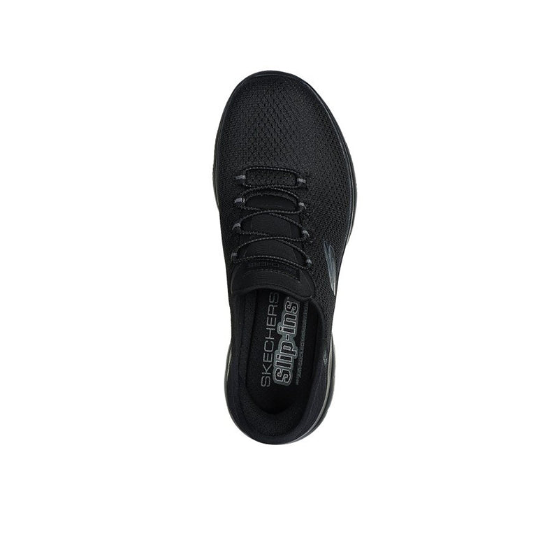 Lightweight black women's sneaker, front view with lace eyelets and logo on tongue