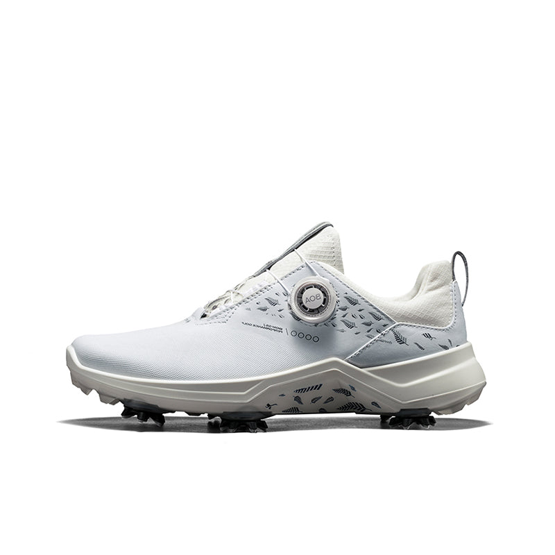 White women's golf shoe, side view, with BOA dial and black studded outsole