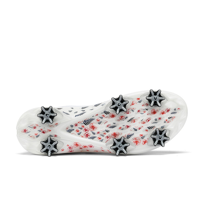 White golf shoe outsole with black star-shaped traction lugs and red accents