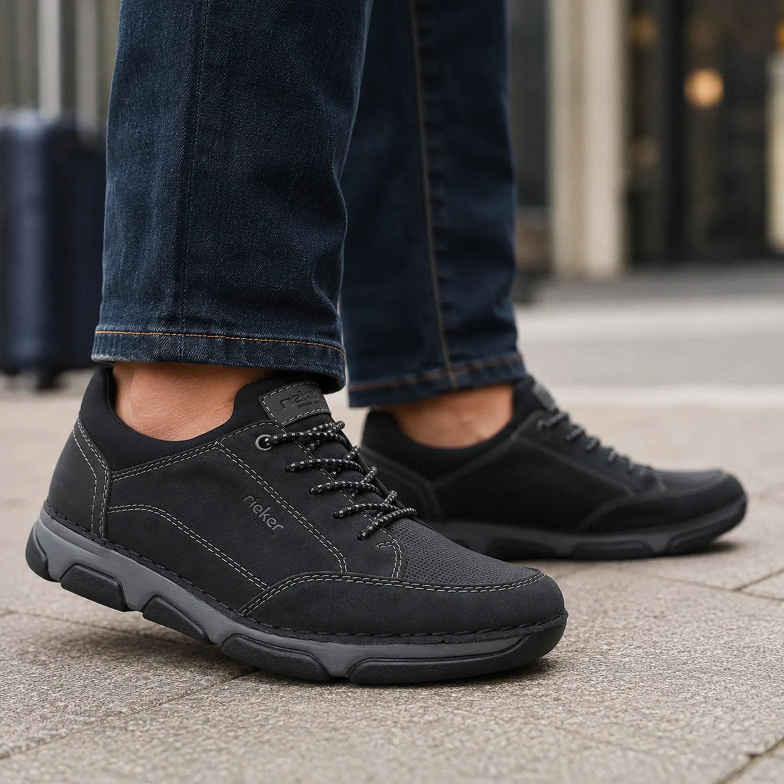 Rieker men's black slip on shoes worn for casual walking and everyday comfort