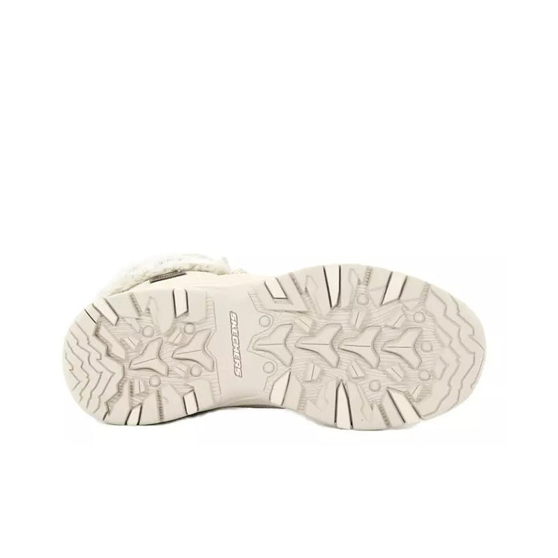 Beige boot outsole with deep tread pattern