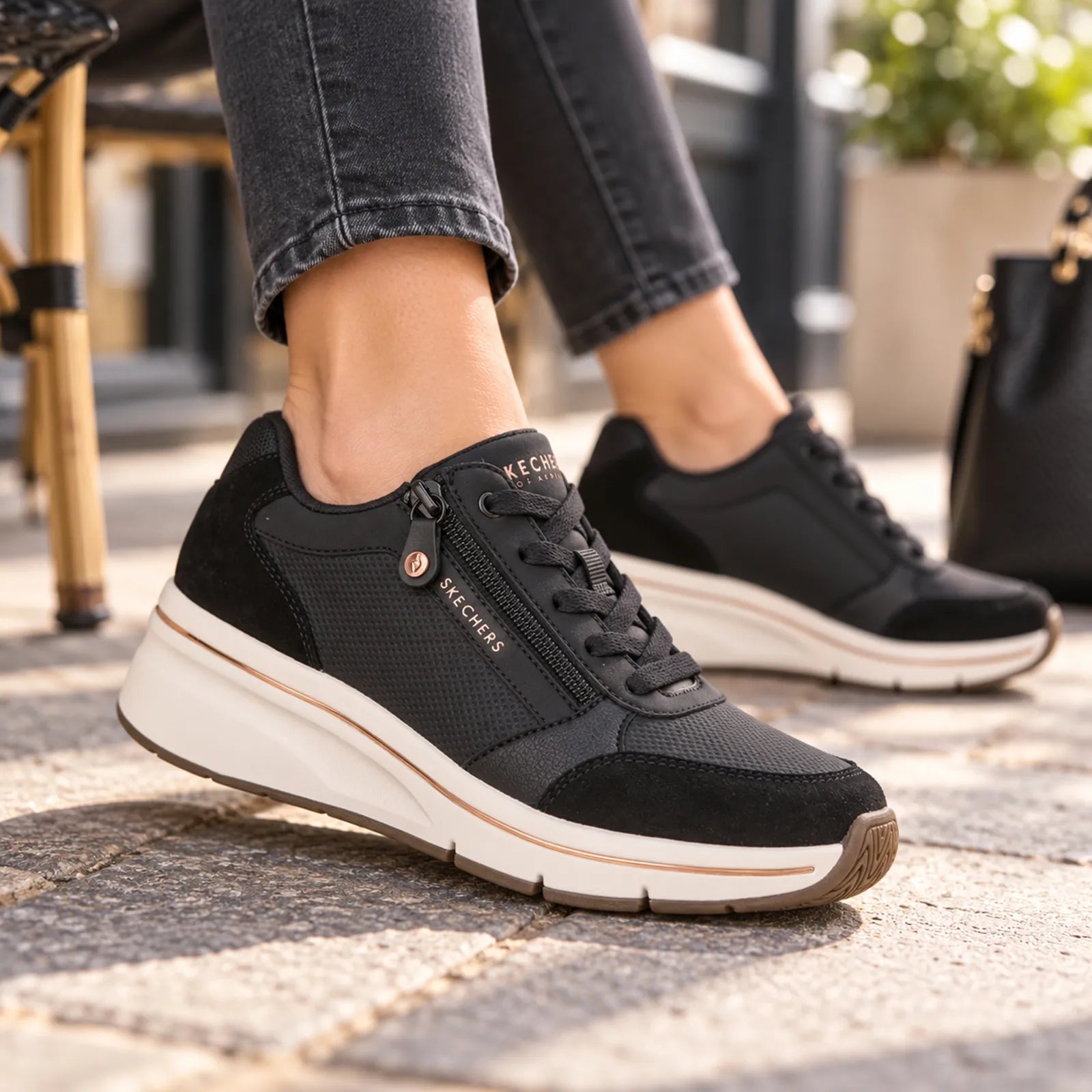 Skechers women's Black wedge trainers styled for casual everyday wear