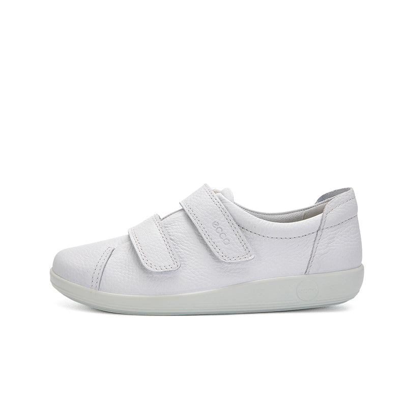 White leather sneakers with two hook-and-loop straps, side view, low-profile sole