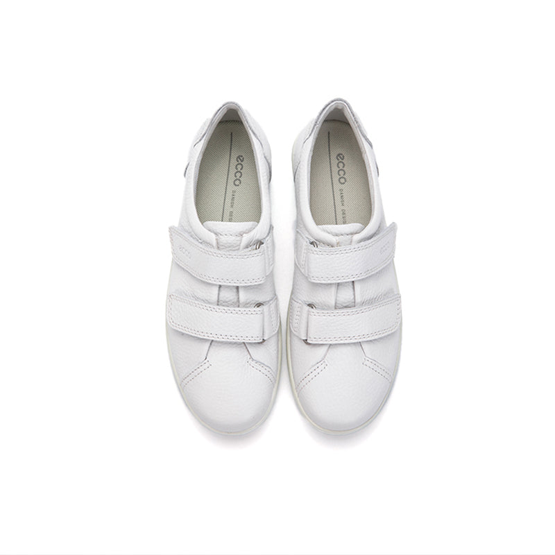 Pair of white leather sneakers with two hook-and-loop straps and rounded toe