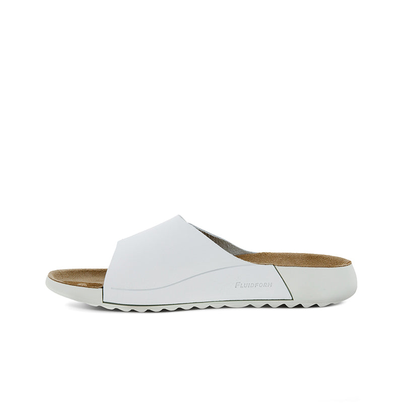 White leather slide sandal with low flat sole and textured outsole