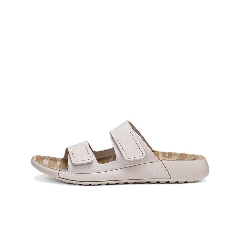 Beige leather slide sandals, side view with two hook-and-loop straps
