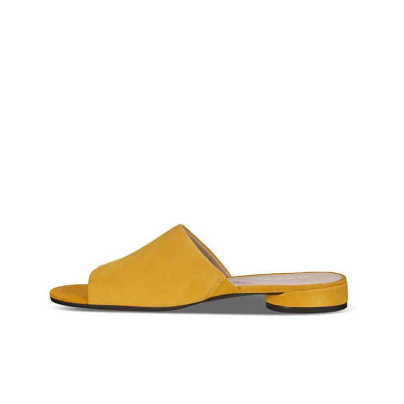 Yellow leather flat slide sandals with wide strap and low-profile outsole