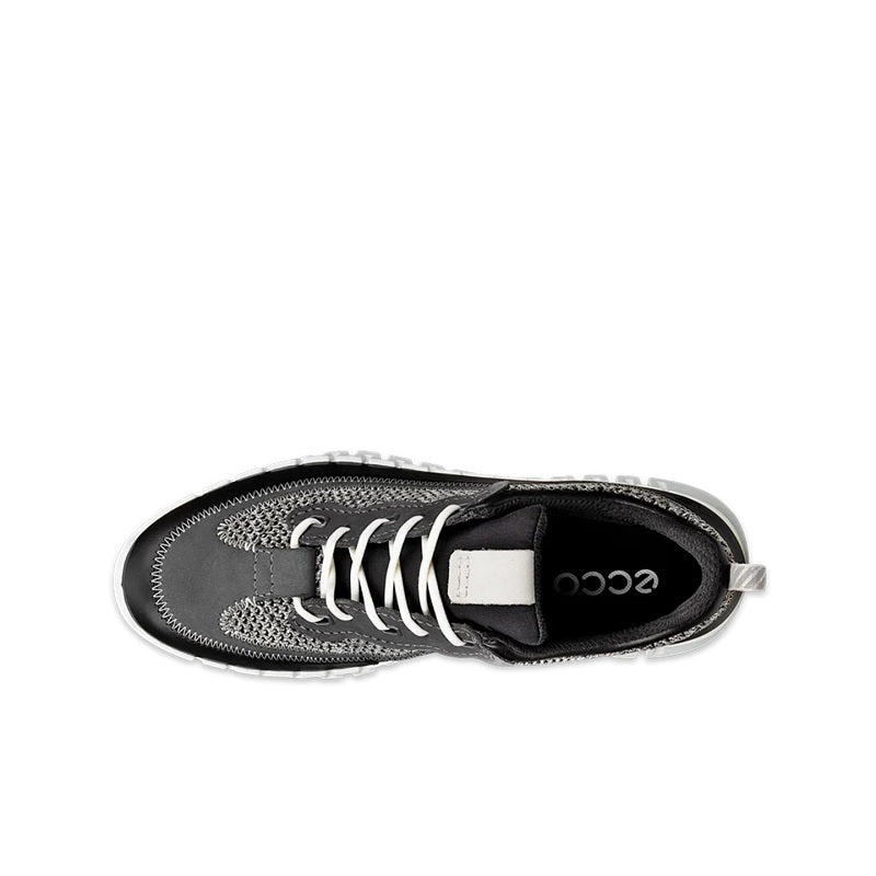 Black sneaker top view with lace-up closure, textured upper, and rubber logo patch