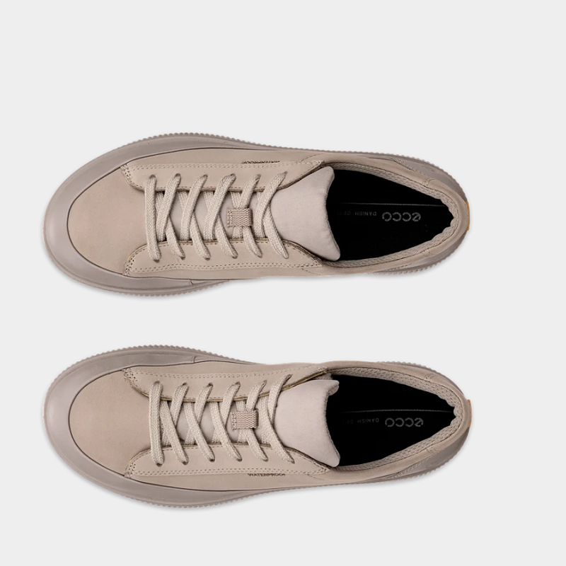 Pair of beige lace-up sneakers with textured collar and cushioned lining
