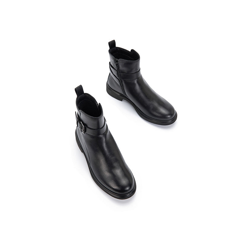 Pair of black leather womens ankle boots with buckle strap and pull-on heel tab