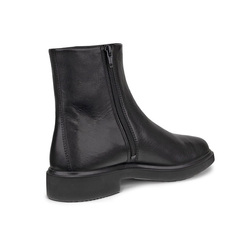 Women's black leather ankle boot with full-length side zipper and chunky sole