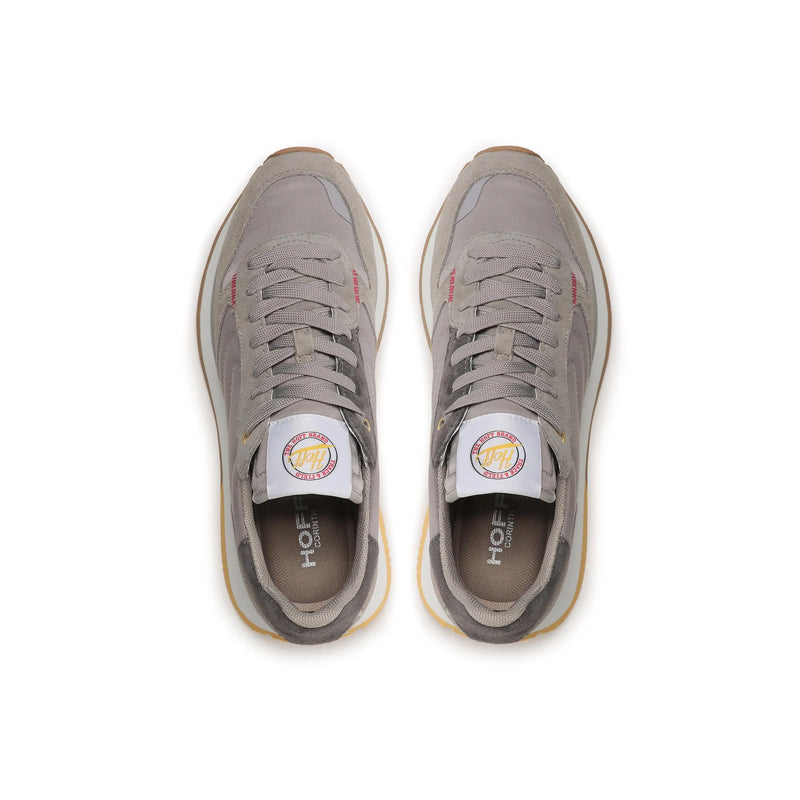 Pair of grey lace-up sneakers with HOFF logo on the tongue and padded collar