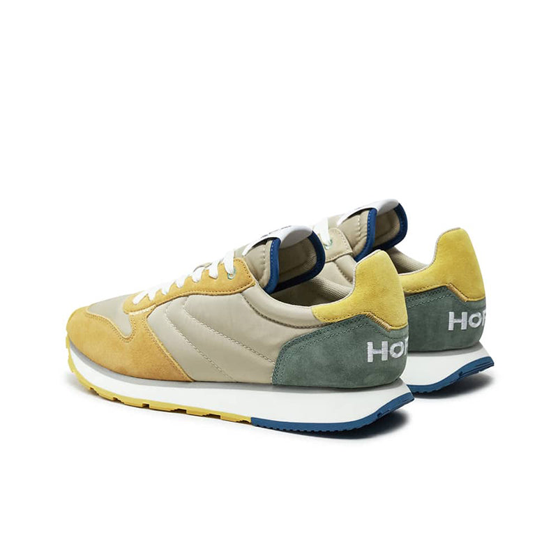 Men's casual sneakers with teal and yellow panels, blue heel and white laces