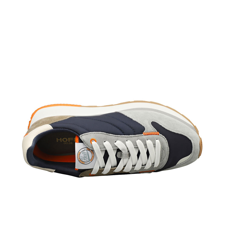 Men's sneakers heel view, navy lining and laces on gray and cream panels, orange sole