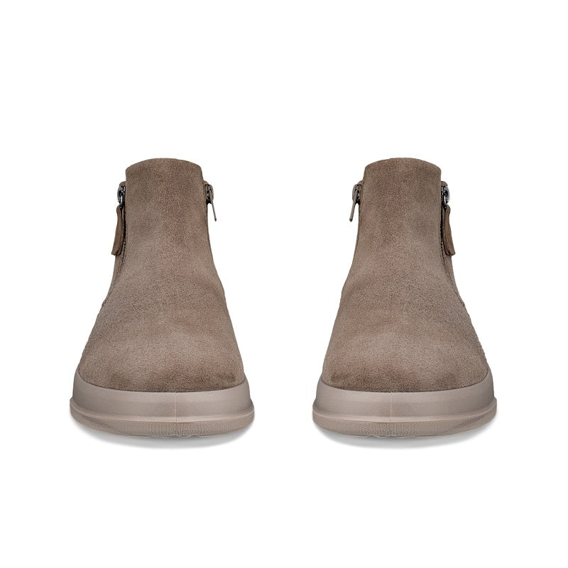 Pair of brown suede ankle boots with side zippers and pull tabs