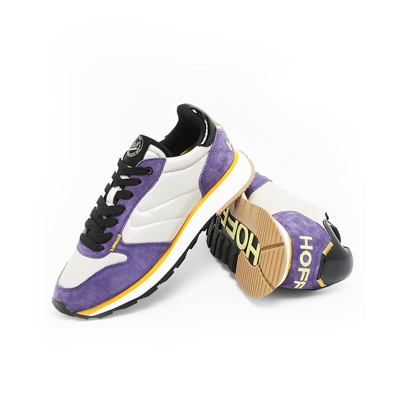 White and purple lace-up sneakers with black collar lining and yellow midsole stripe