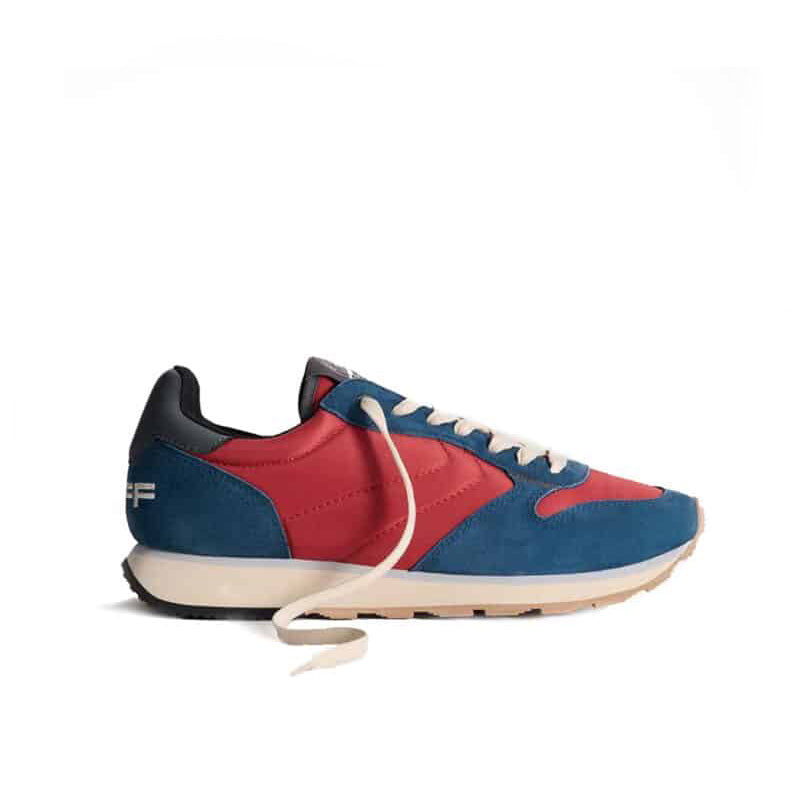 Men's sneakers with red and blue uppers, white laces, and beige sole.