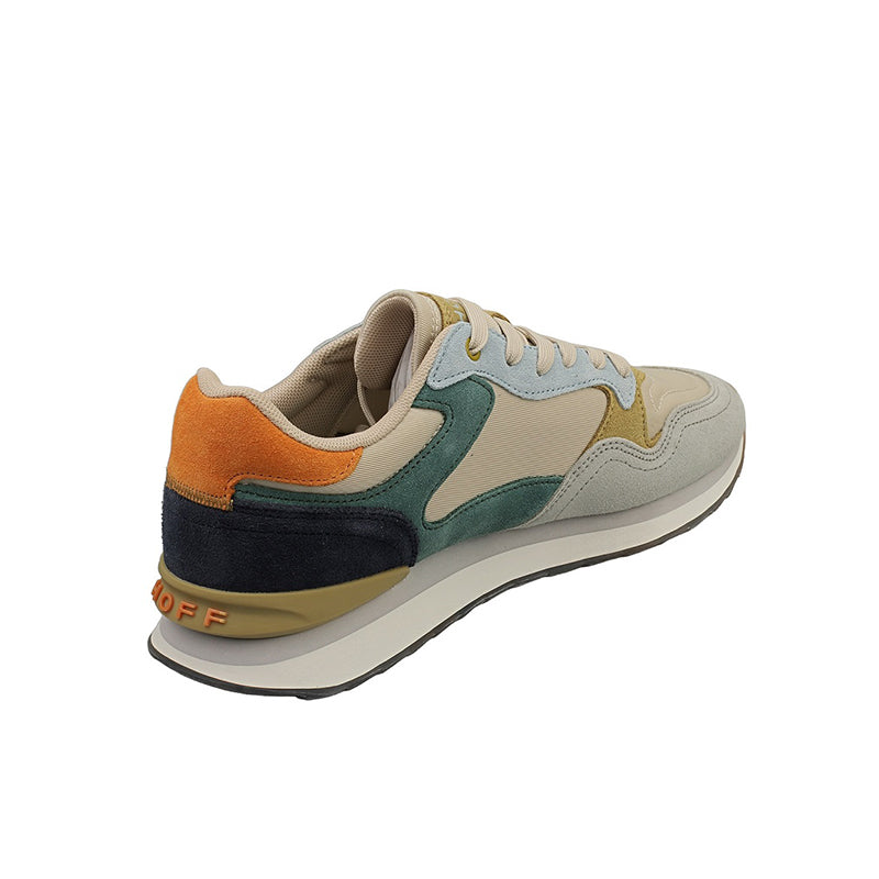 Men's leather sneakers with orange heel, dark navy side panel, cream and teal uppers.