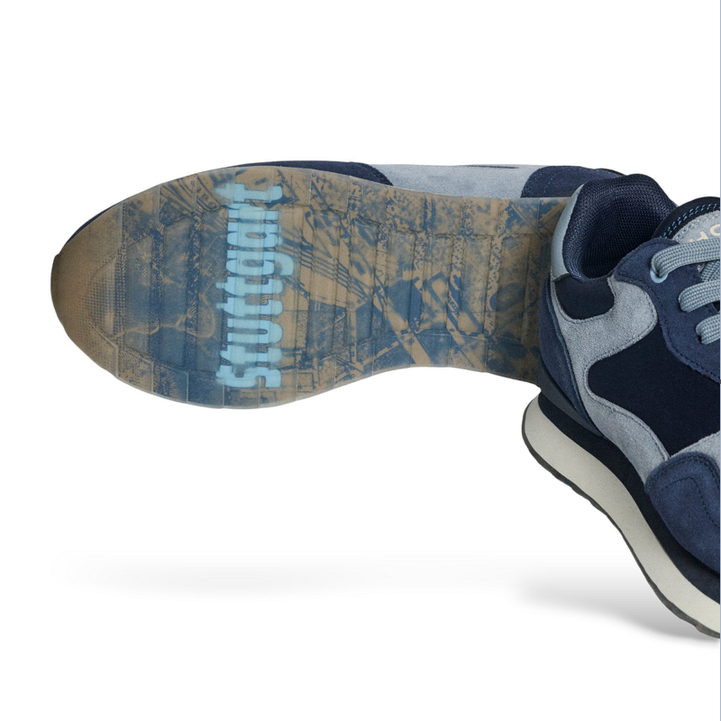 Men's blue leather sneaker outsole with textured tread and brand print