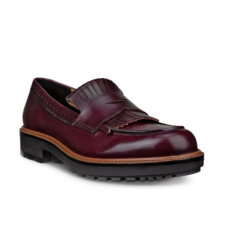 Burgundy leather loafer with kiltie fringe detail and tan-trimmed sole