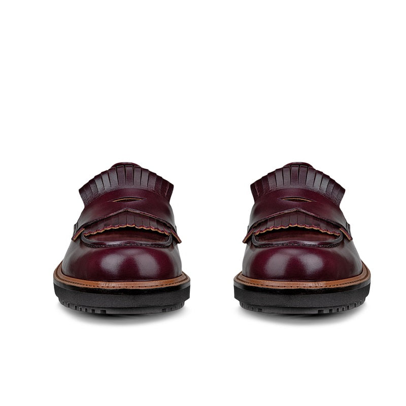 Pair of burgundy leather loafers, rear view with tan edge trim