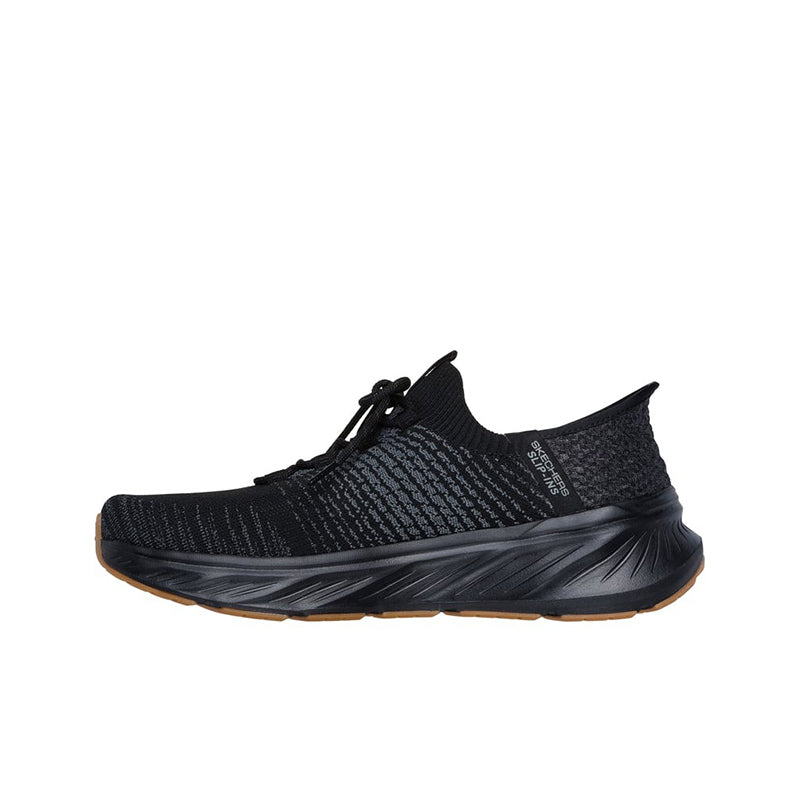 Black low-top knit sneaker with lace-up closure and rugged tread sole, side view.