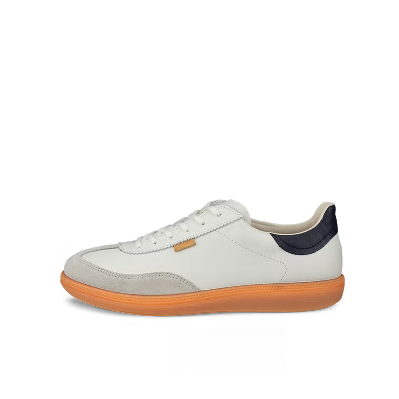 Low-top lace-up sneakers with white upper, navy heel, and orange rubber outsole
