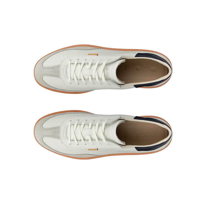 Low-top sneakers with white uppers, white laces, tan lining, orange outsole